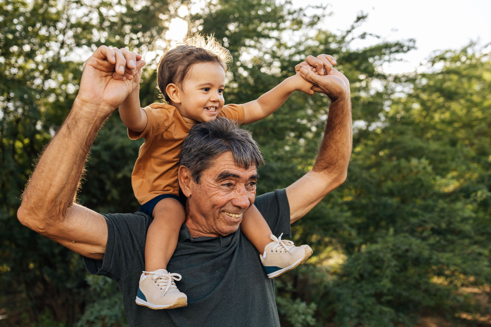 Grandfather playing with his grandchild.